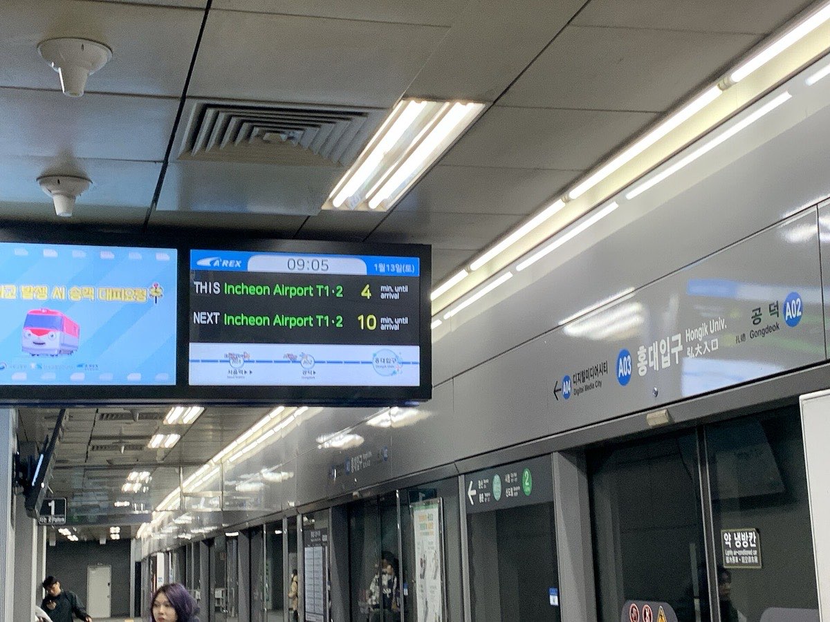 AREX platform at Hongik University Station with the departure board