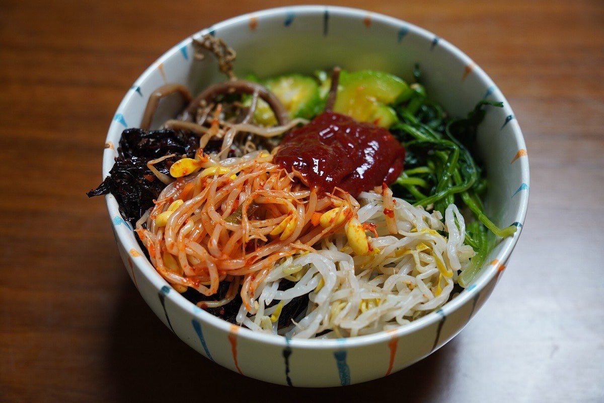 A bowl of bibimbap with vegetables