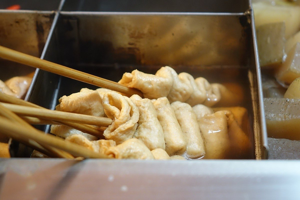 Fish cakes on skewers in hot broth