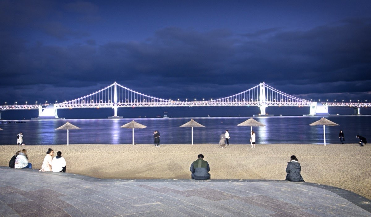 Gwangan Bridge lit up at night over Gwangalli Beach