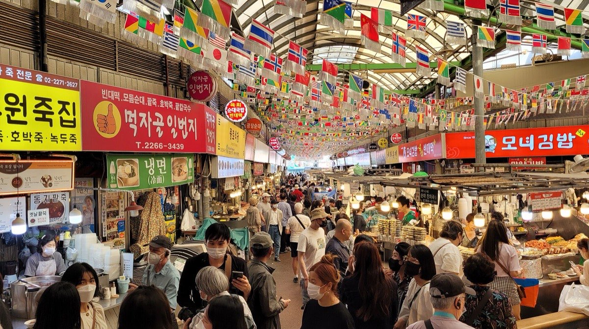 Crowded food stall aisle in Gwangjang Market