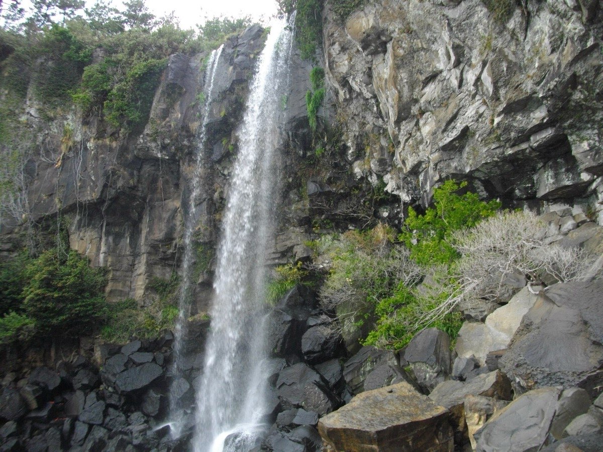Jeongbang Falls dropping into the sea