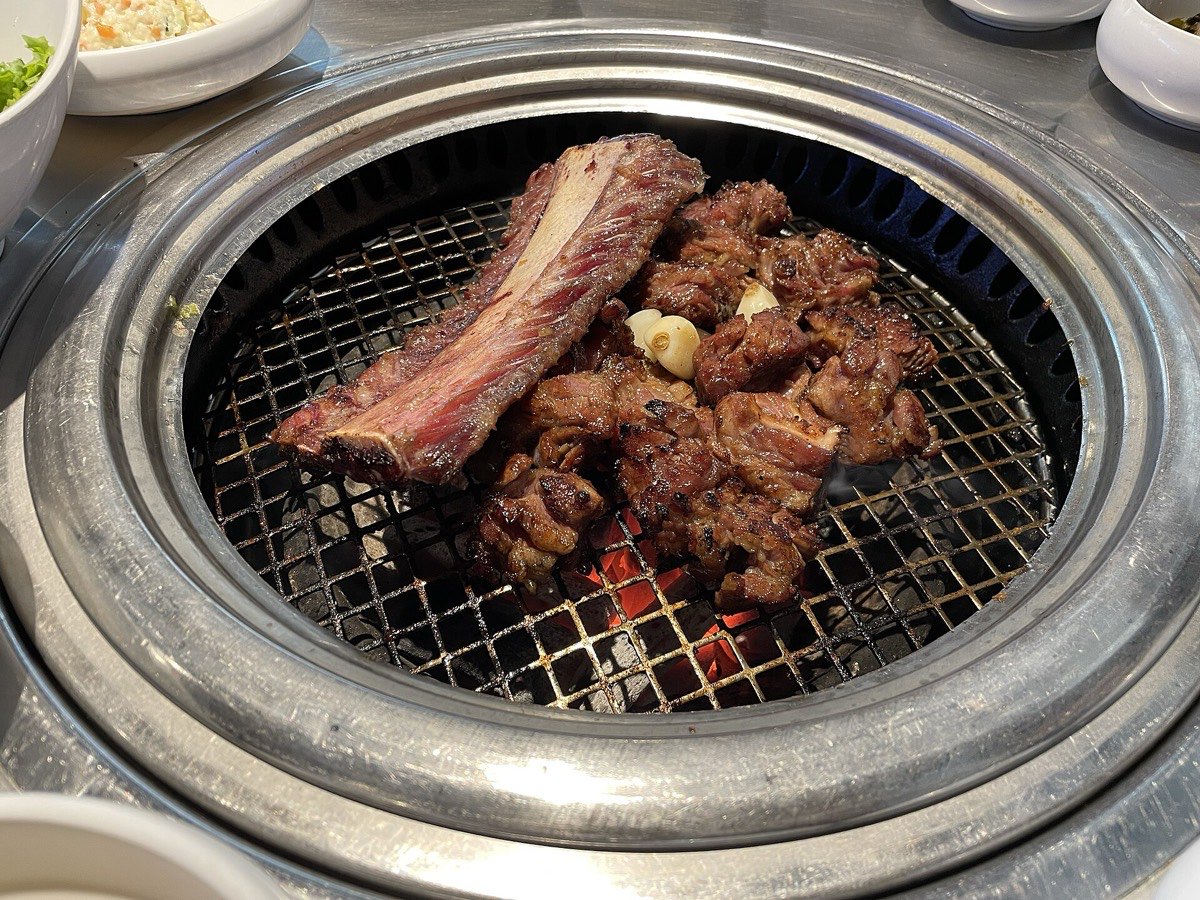 Korean pork BBQ grilling over charcoal