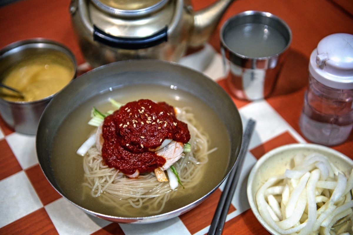 Milmyeon, Busan wheat cold noodles, in a brass bowl